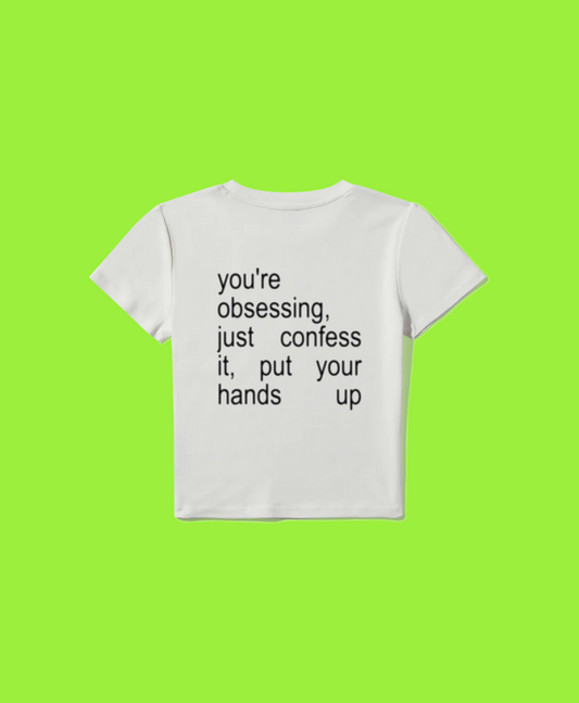 you’re obsessing, just confess it baby tee